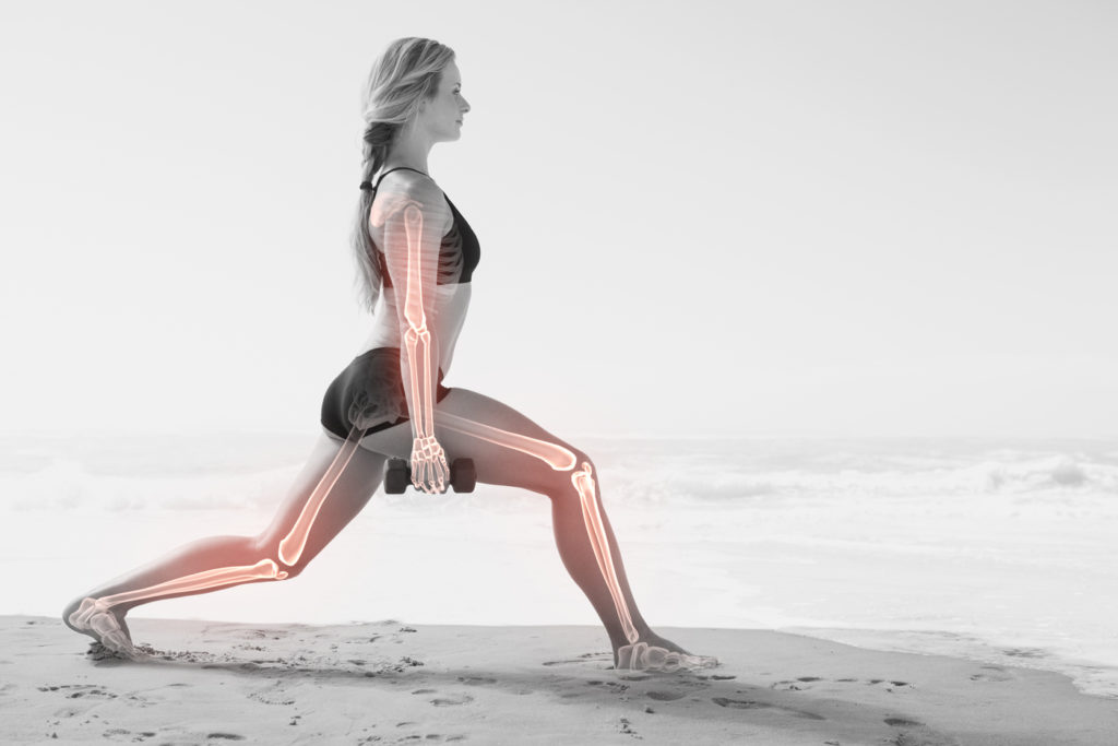 Digital,Composite,Of,Highlighted,Bones,Of,Exercising,Woman