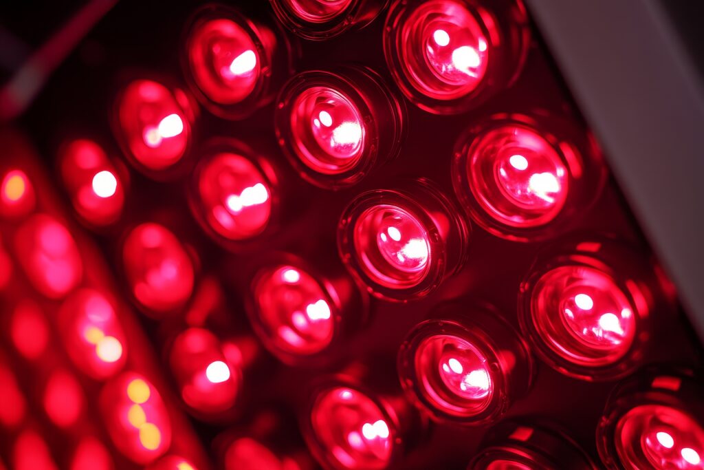 A close-up image of a red light therapy panel, showcasing the powerful red LED lights used for promoting skin health, reducing inflammation, and boosting collagen production. This technology offers a natural and non-invasive approach to wellness.